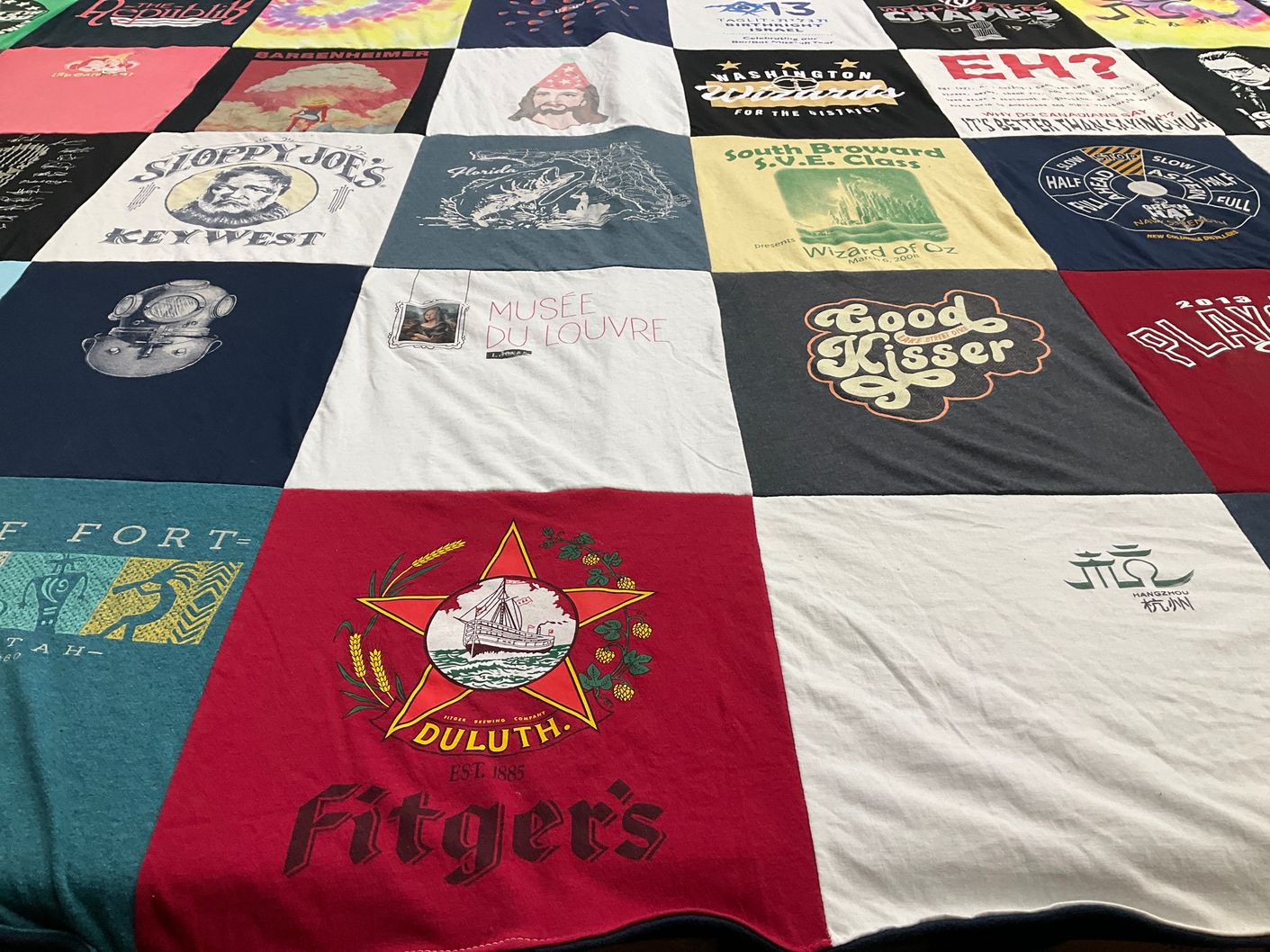 T-shirt quilt with travel, restaurants themes by Silka from MN