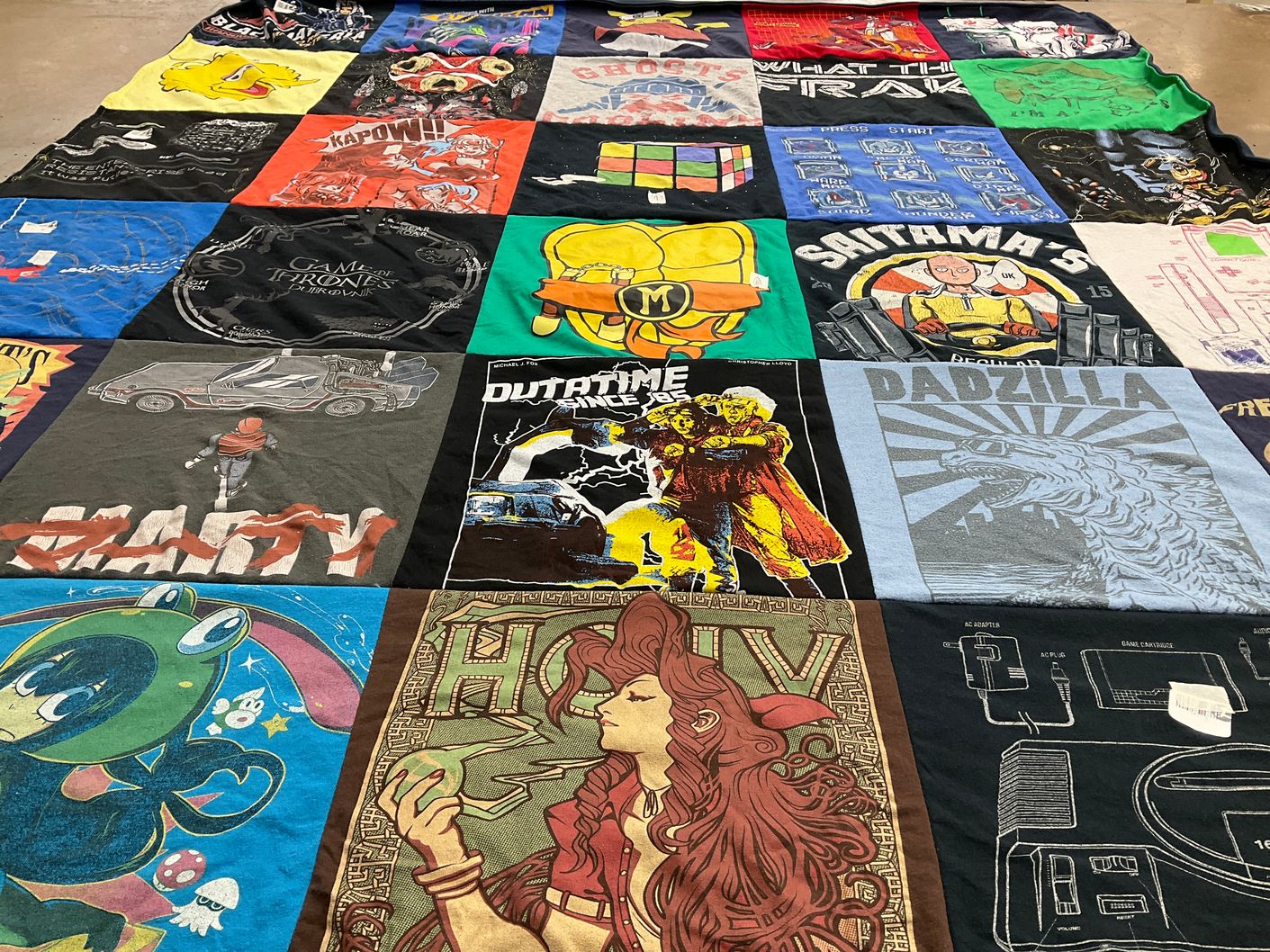T-shirt quilt with gaming, tv shows themes by Lexie from CA