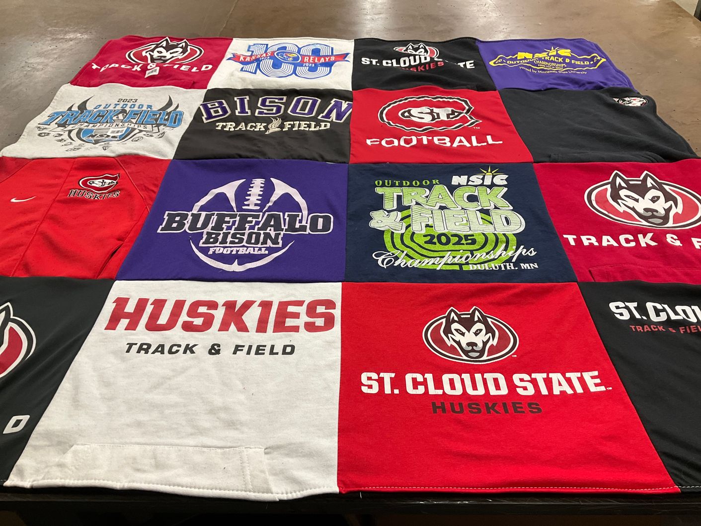 T-shirt quilt featuring bison football, huskies track and field by Katie from MN