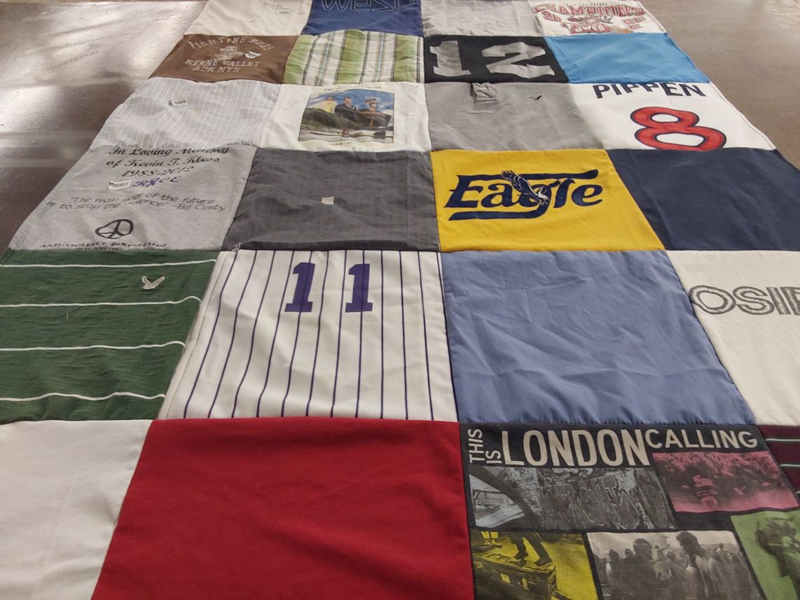 T-shirt quilt with sports, music themes by Kendall from NY