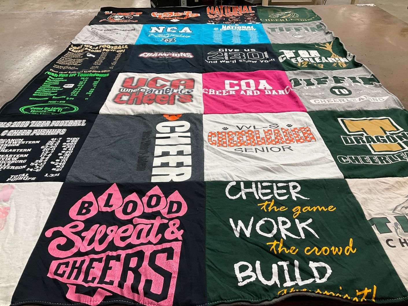 T-shirt quilt with cheerleading themes by Erin from MI