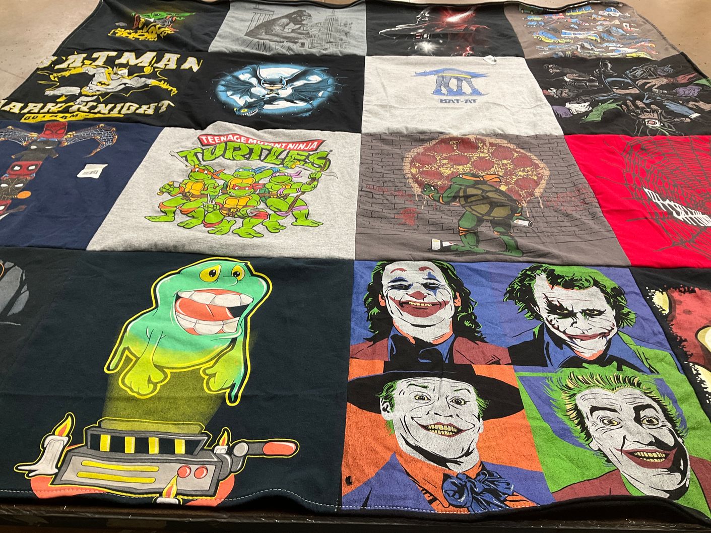T-shirt quilt with comics, movies themes by Angelica from TX