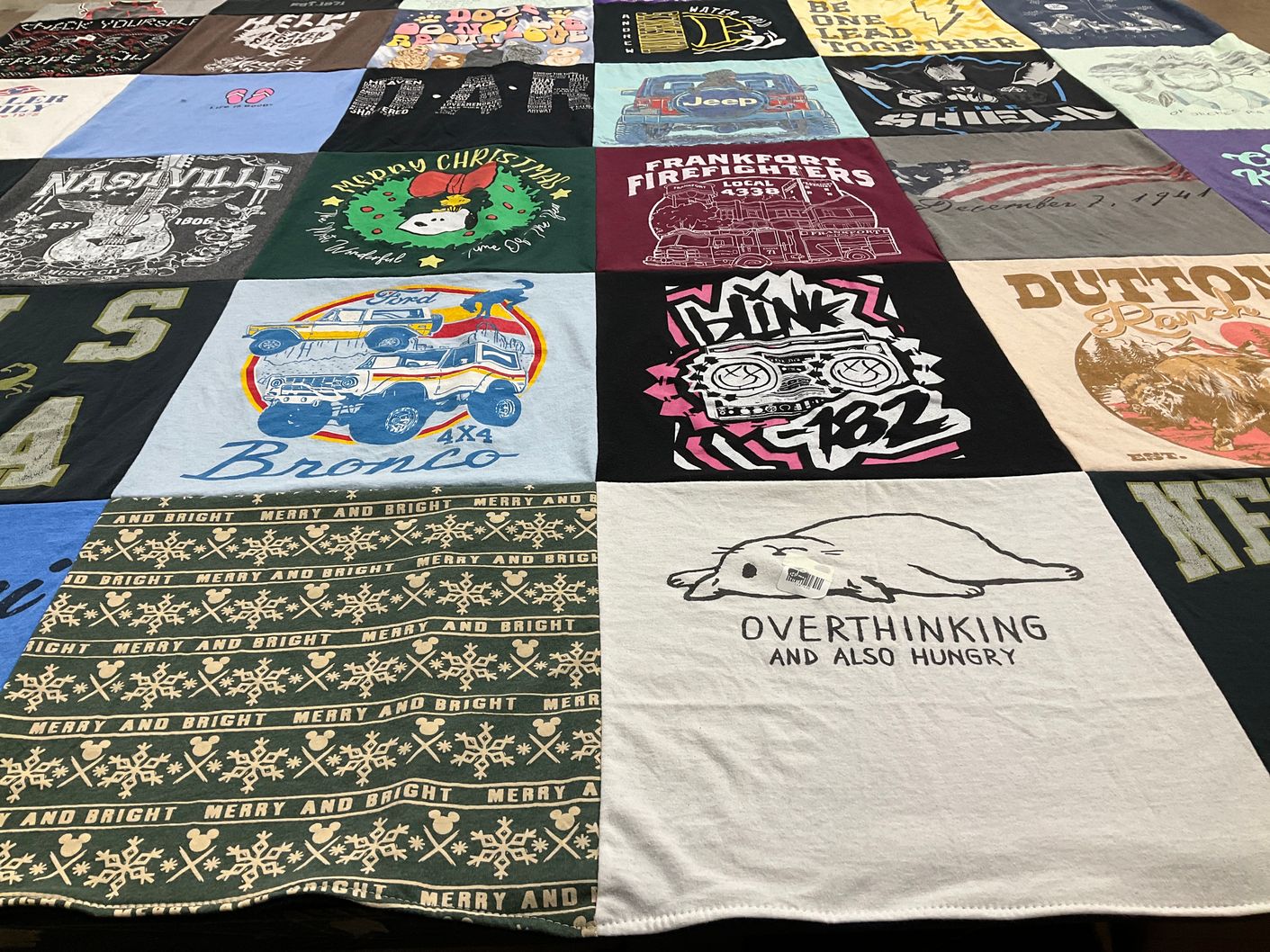 T-shirt quilt with music, firefighting themes by Julie from IL