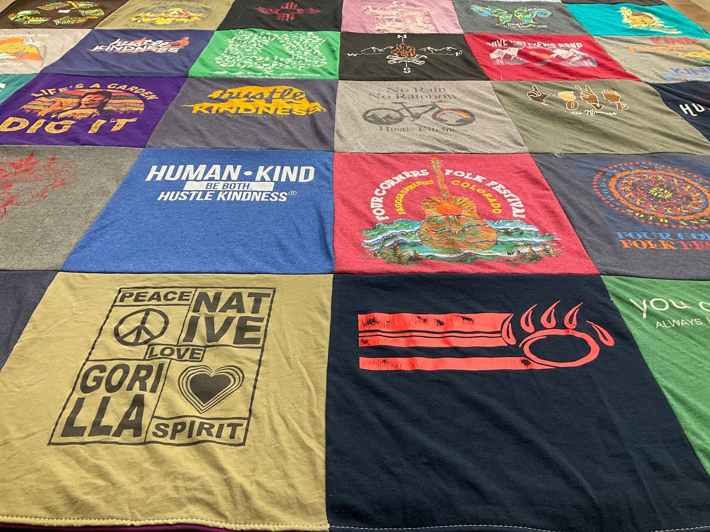 T-shirt quilt with folk music, gardening themes by Thomas from CO