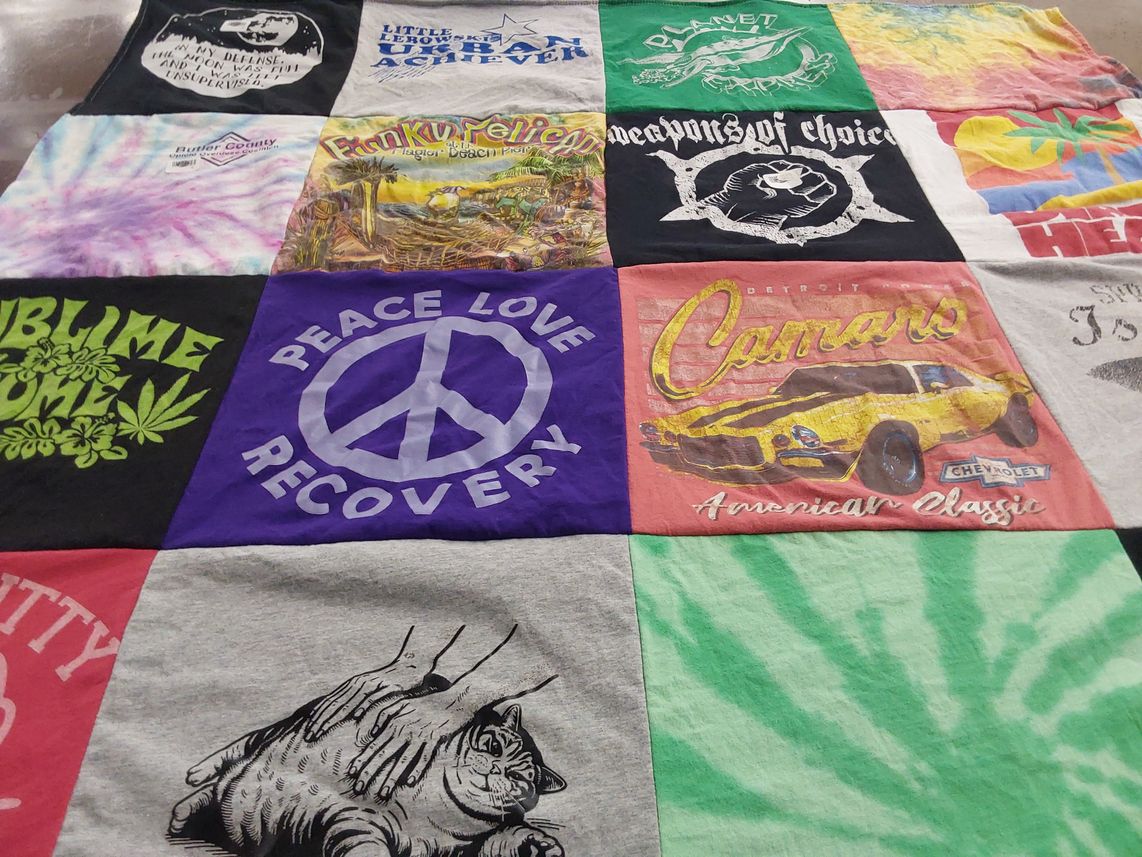 T-shirt quilt with music, cars themes by Carolyn from PA
