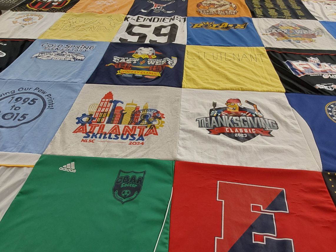 T-shirt quilt with sports, hockey themes by Melanie from PA