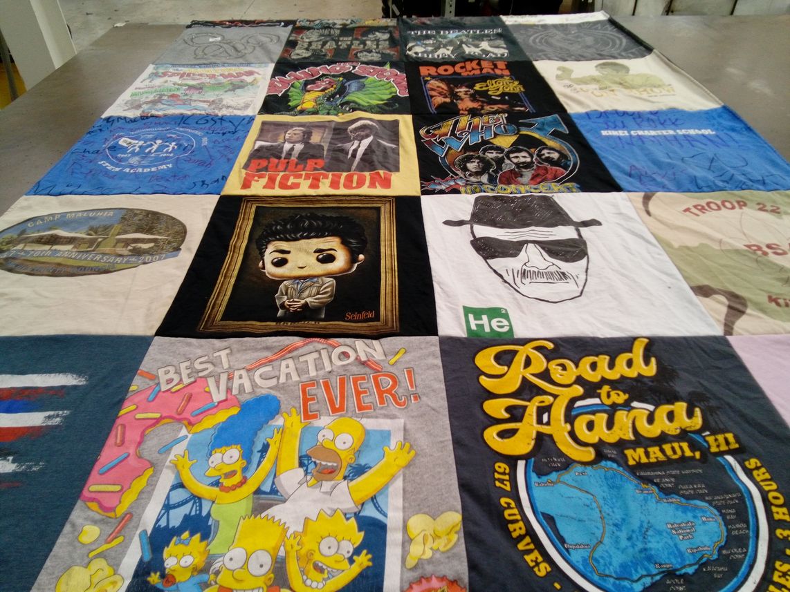 T-shirt quilt with vacation, movies themes by Mary from HI