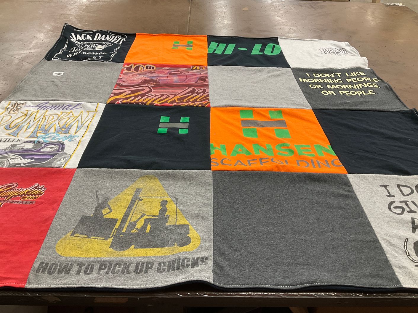 T-shirt quilt with drinking, scaffolding themes by Rebecca from OH