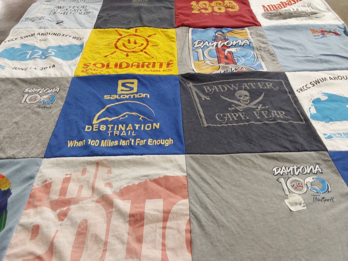 T-shirt quilt with swimming, running themes by Emily from CA