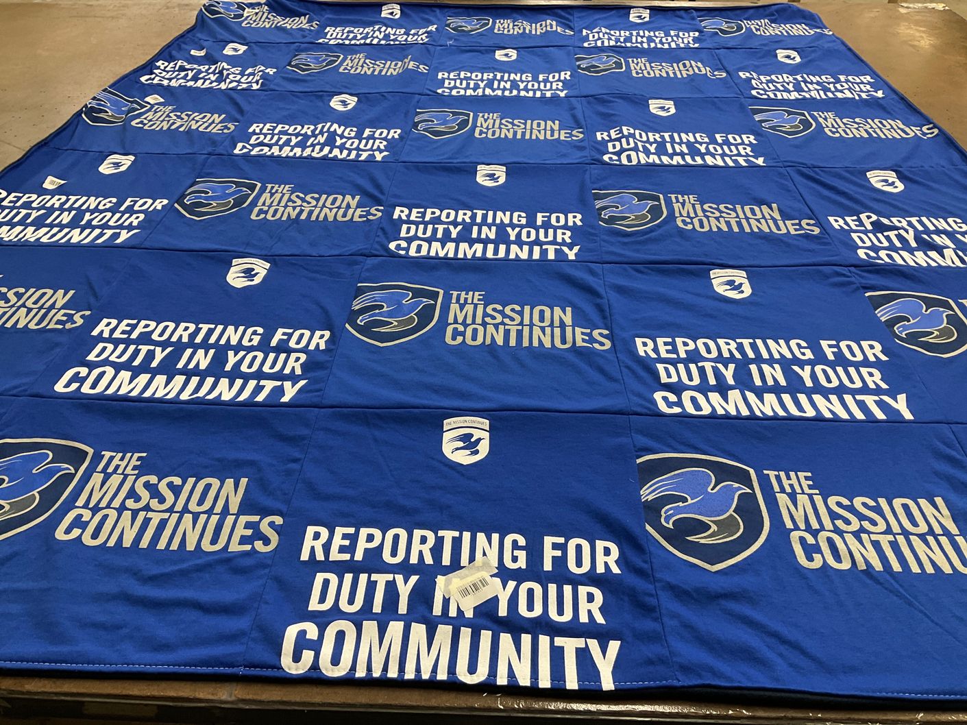 T-shirt quilt with community service, veteran support themes by Kenric from IL