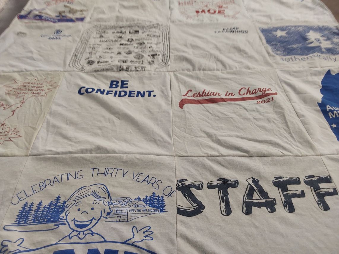 T-shirt quilt with community, support themes by Ana from ME