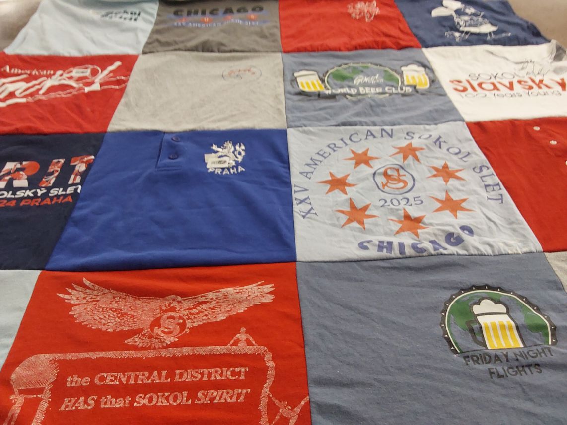 T-shirt quilt with community events, cultural organizations themes by Kathleen from IL