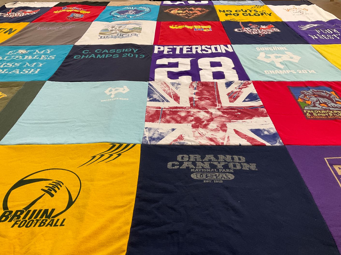 T-shirt quilt with sports, outdoors themes by Kimberly from VA