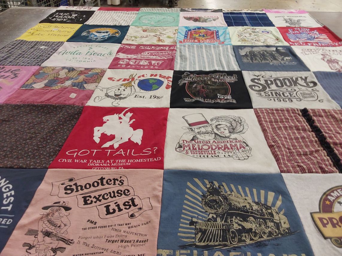 T-shirt quilt with historical, theater themes by Kathleen from CA
