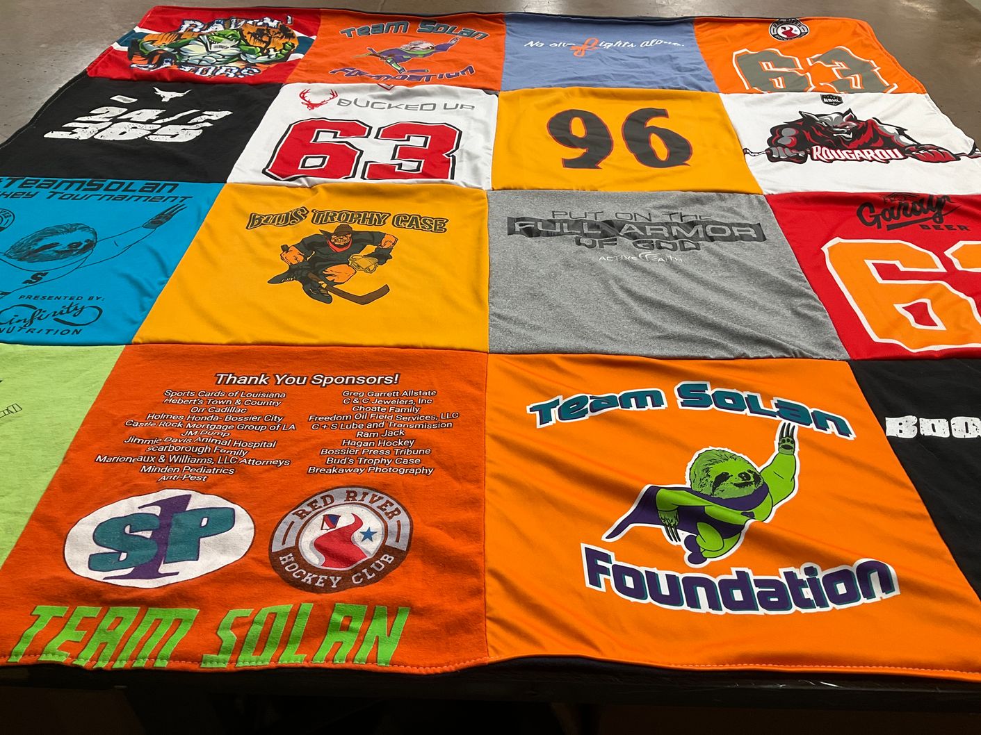 T-shirt quilt with hockey, sponsorships themes by Janice from LA