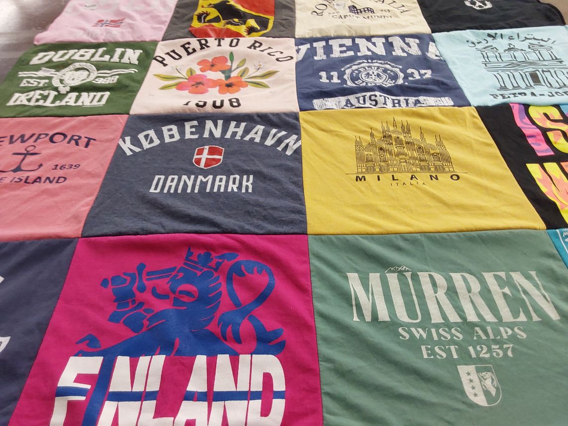 T-shirt quilt with travel, geography themes by Elana from MA