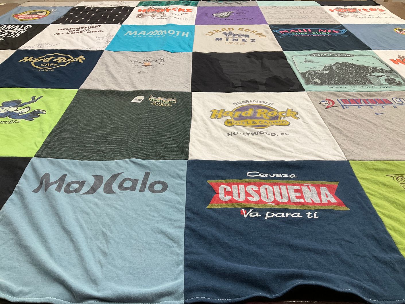 T-shirt quilt with travel, food themes by Jennifer from WA