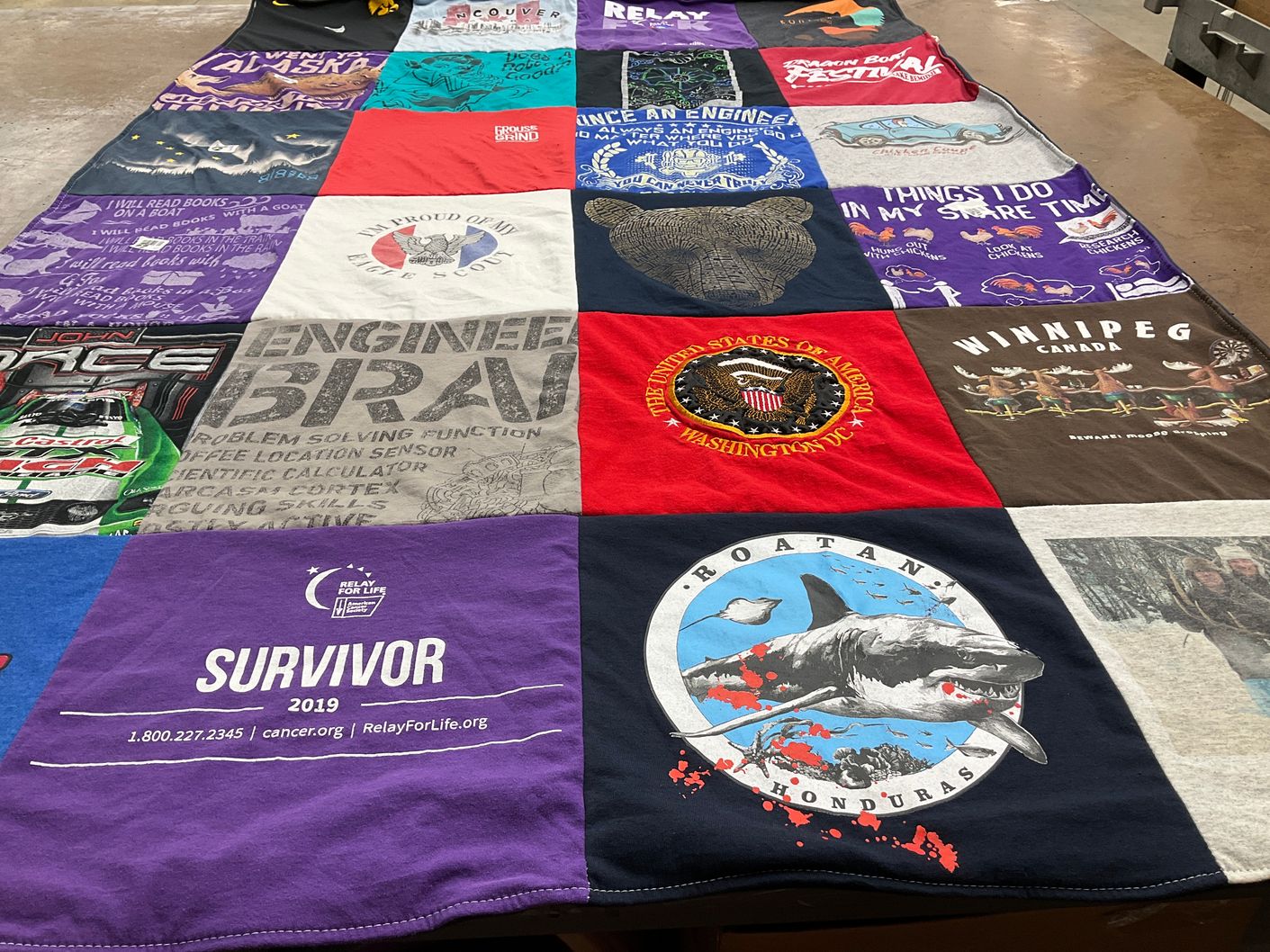 T-shirt quilt with engineering, books themes by Nancy from MN