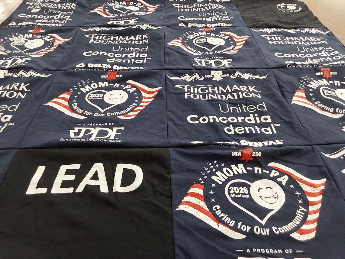 T-shirt quilt with community service, dental health themes by Linda from PA
