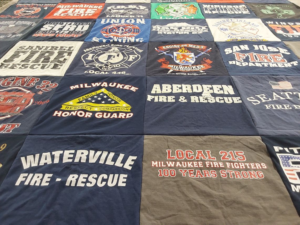 T-shirt quilt with firefighting, emergency services themes by Chrystal from PA