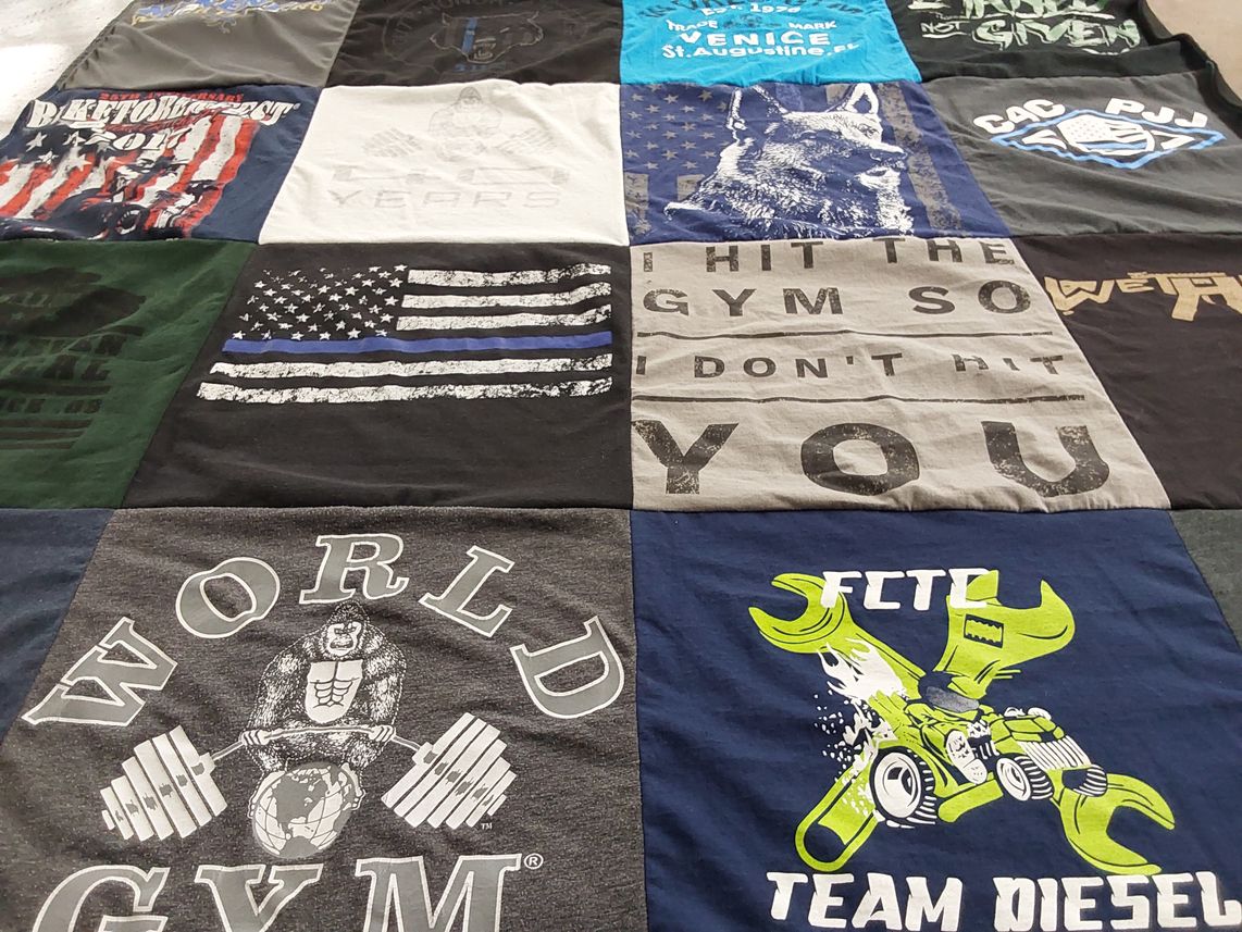 T-shirt quilt with fitness, weightlifting themes by Lynda from FL
