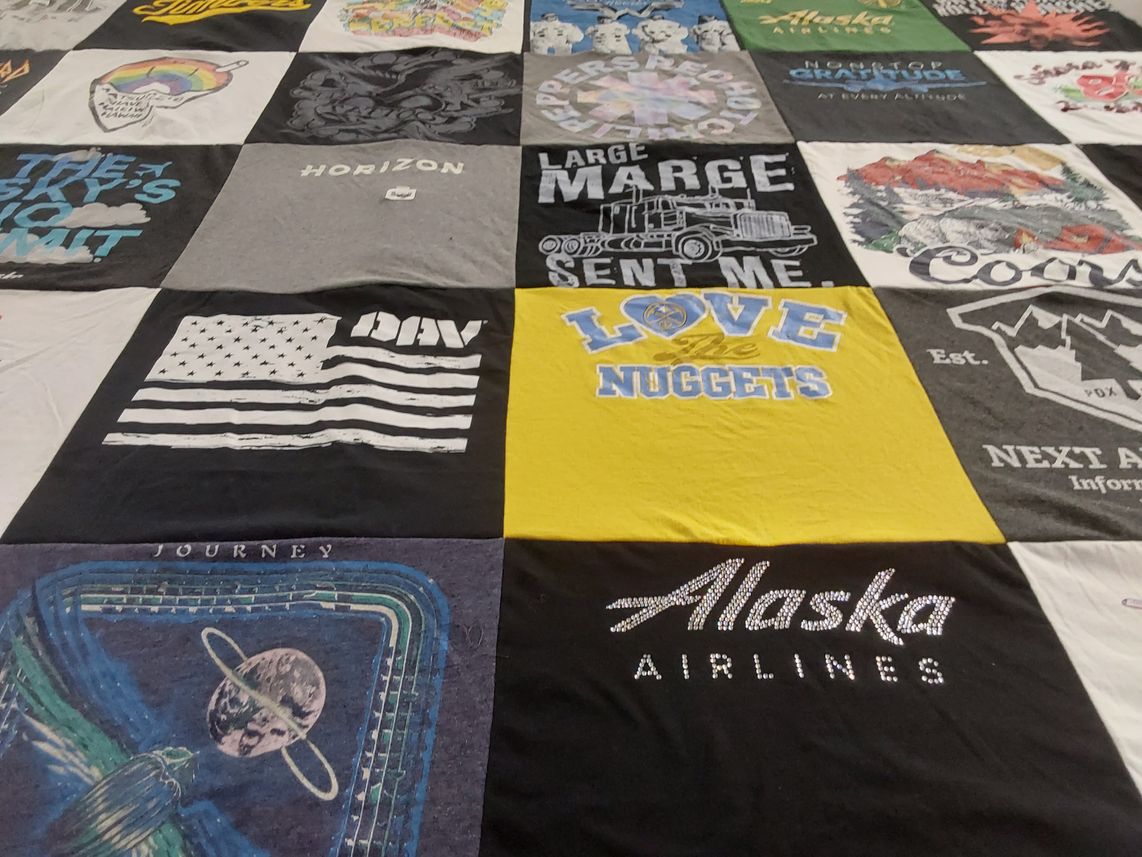 T-shirt quilt with travel, sports themes by Bernadette from OR