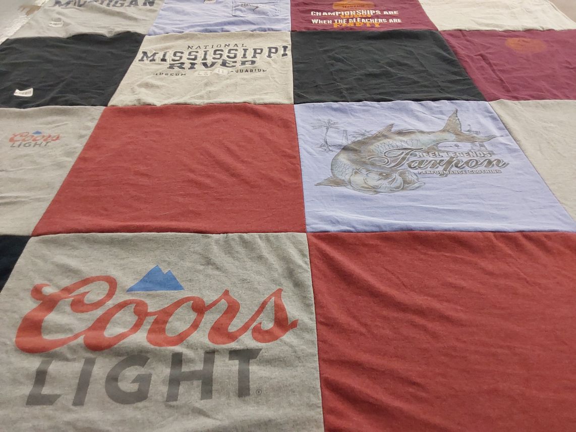 T-shirt quilt with fishing, beer themes by Sylvia from MI