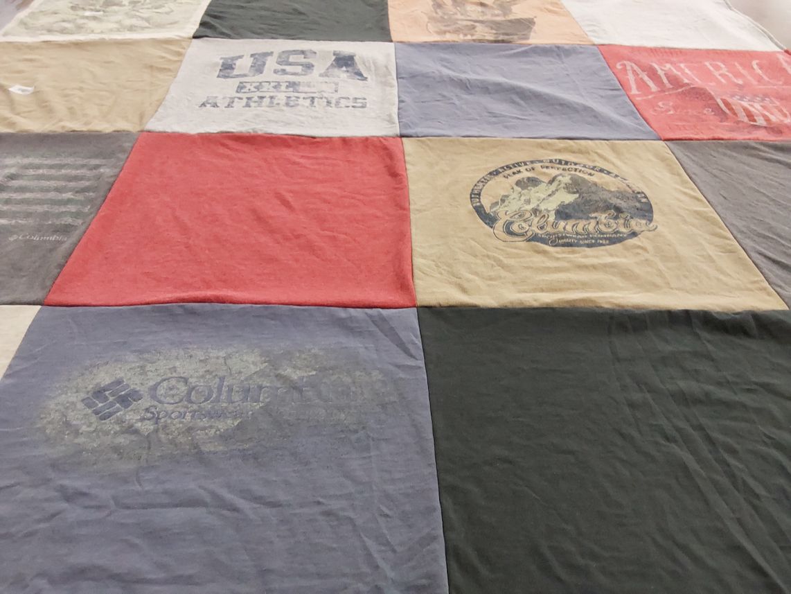 T-shirt quilt with sports, outdoors themes by Sylvia from MI