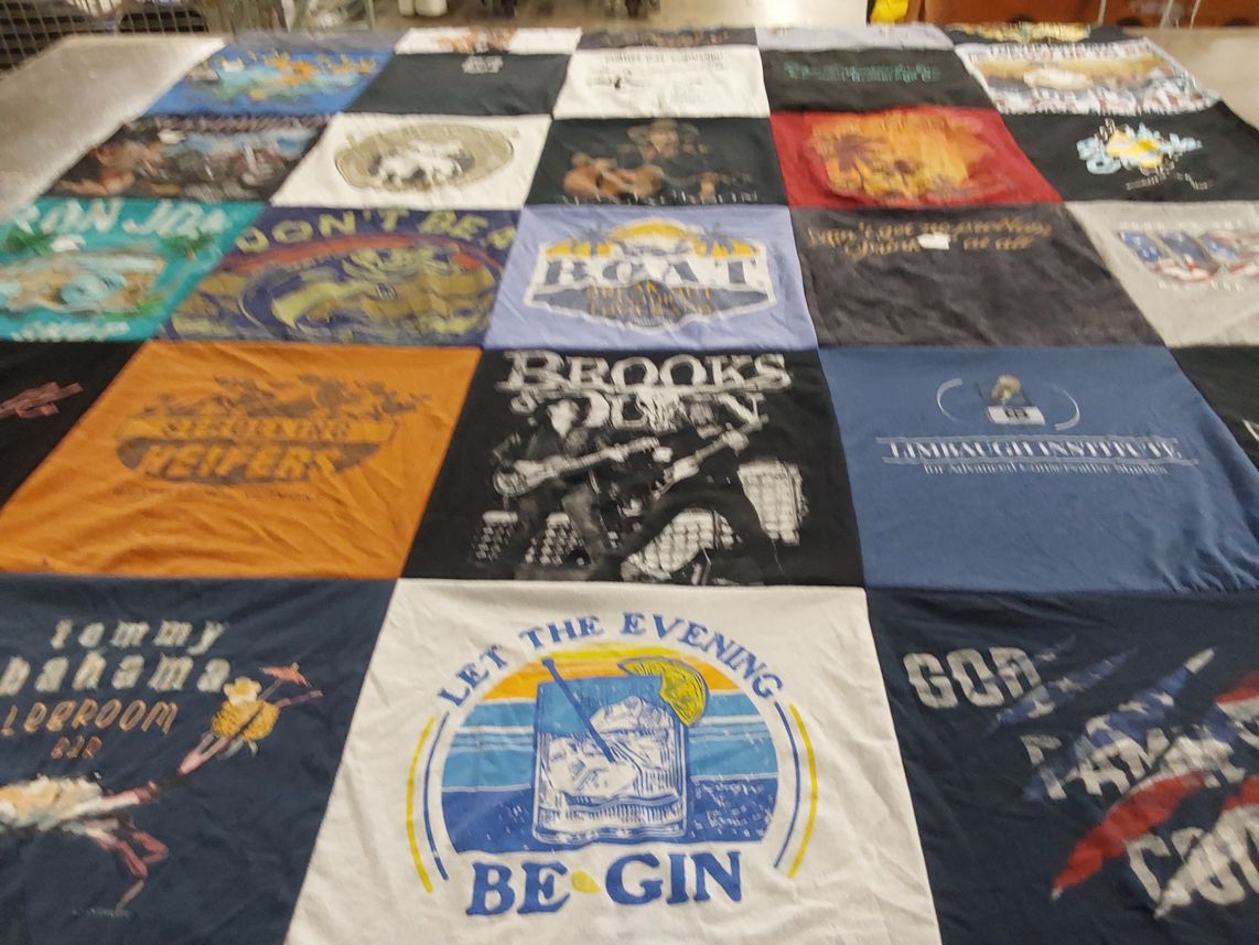 T-shirt quilt with music, beverage themes by Katie from IA
