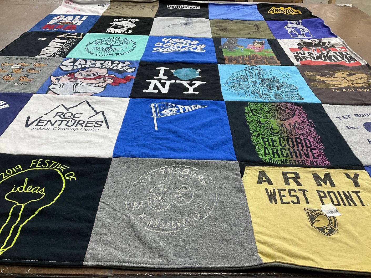 T-shirt quilt with climbing, outdoor themes by Shanna from NY