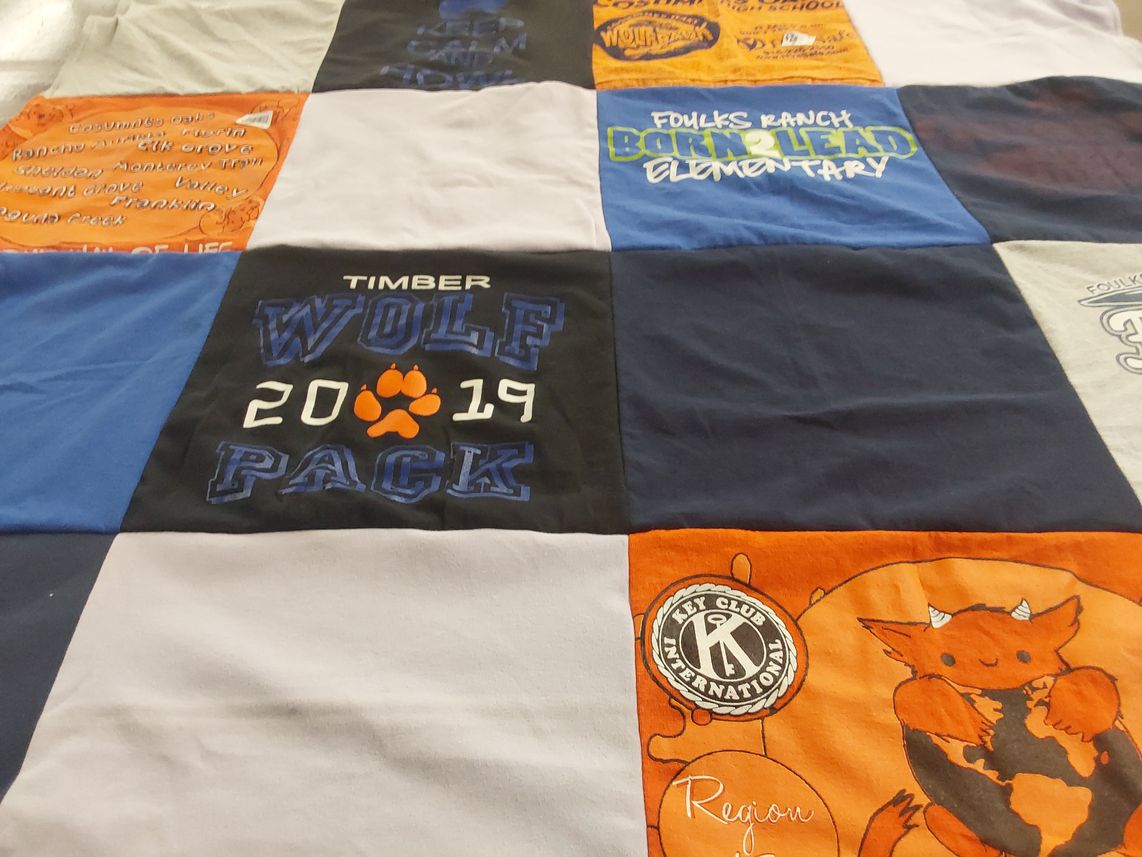 T-shirt quilt featuring timber wolf pack by Faith from CA