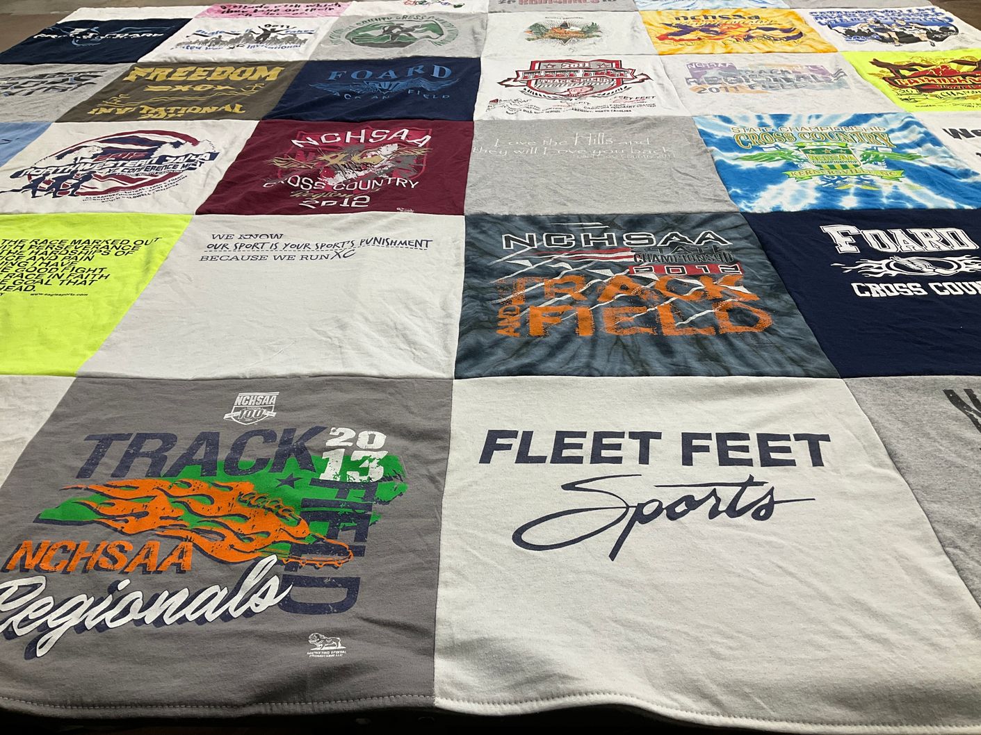 T-shirt quilt with cross country, track and field themes by Kaitlyn from NC