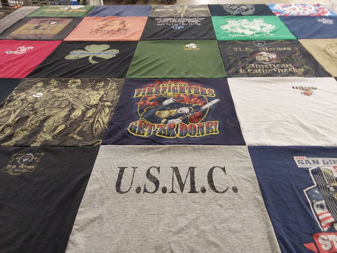 T-shirt quilt with military, firefighting themes by Barbara from GA
