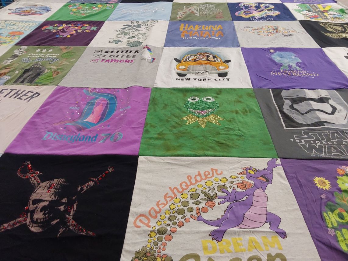 T-shirt quilt with disney, amusement parks themes by Linda from NY