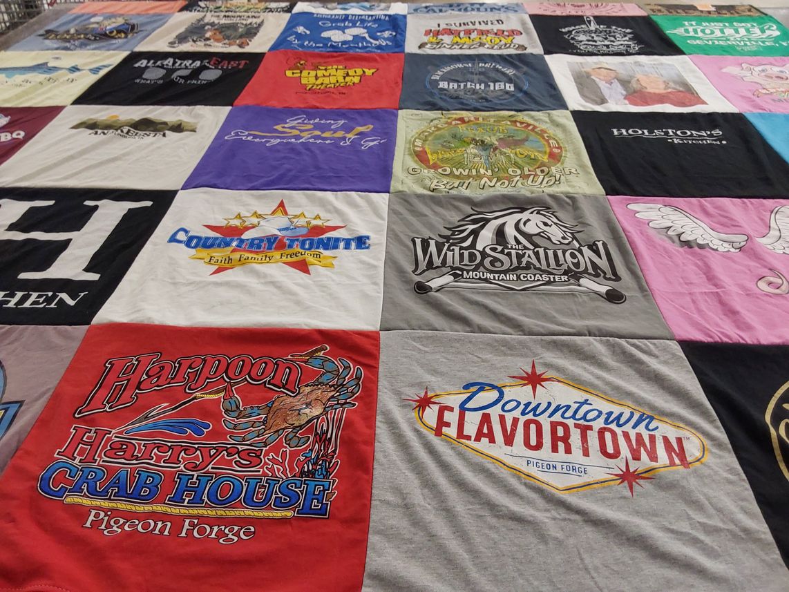 T-shirt quilt with theme parks, music themes by Laura from TN
