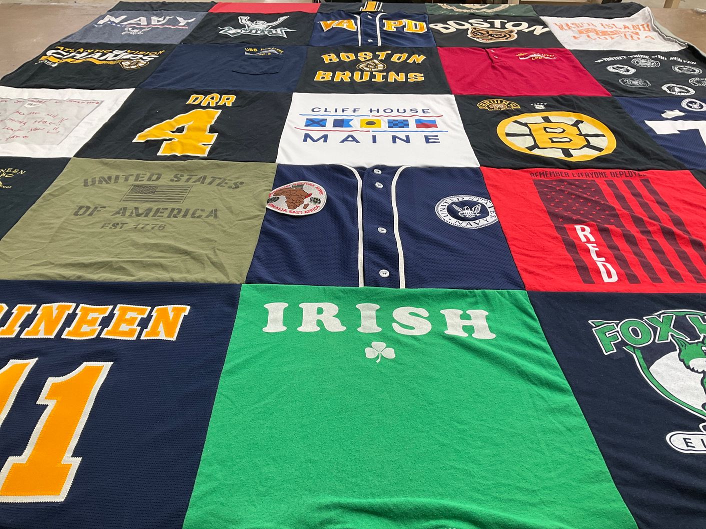T-shirt quilt with sports, military themes by Holly from MA