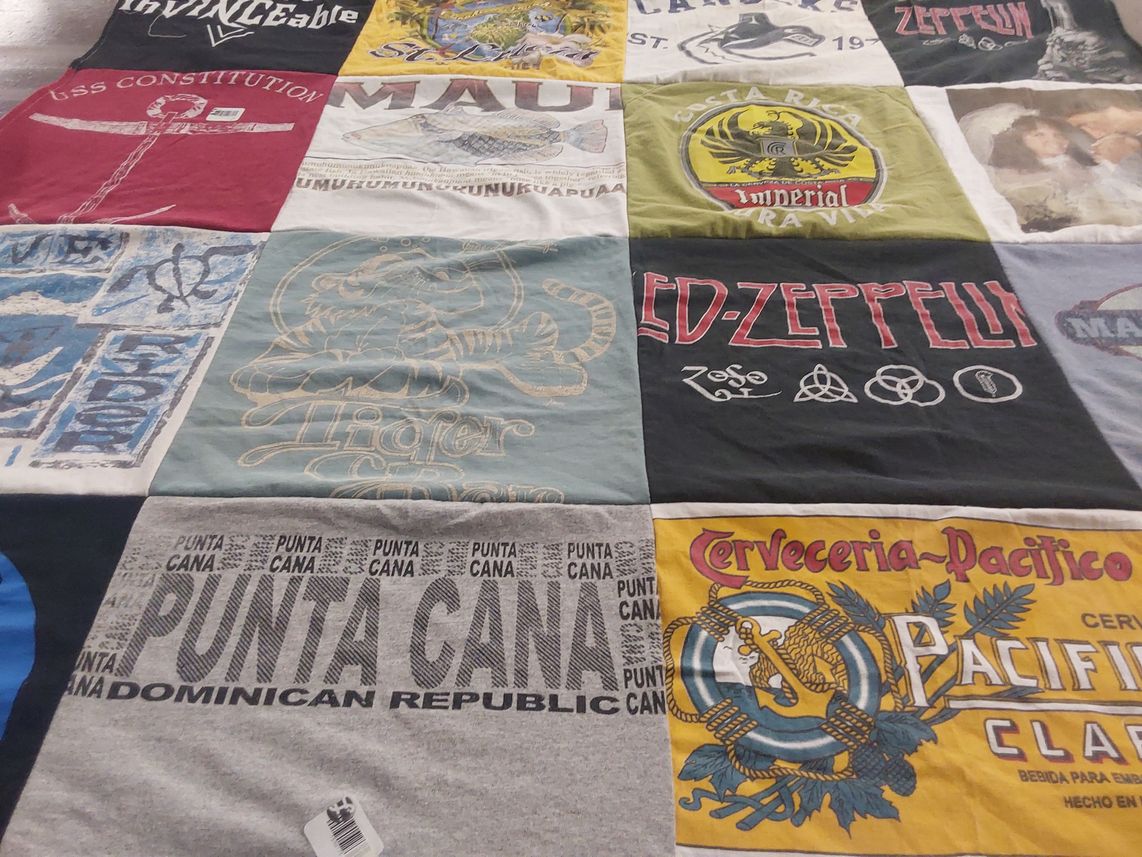 T-shirt quilt with music, travel themes by Lesley from OR