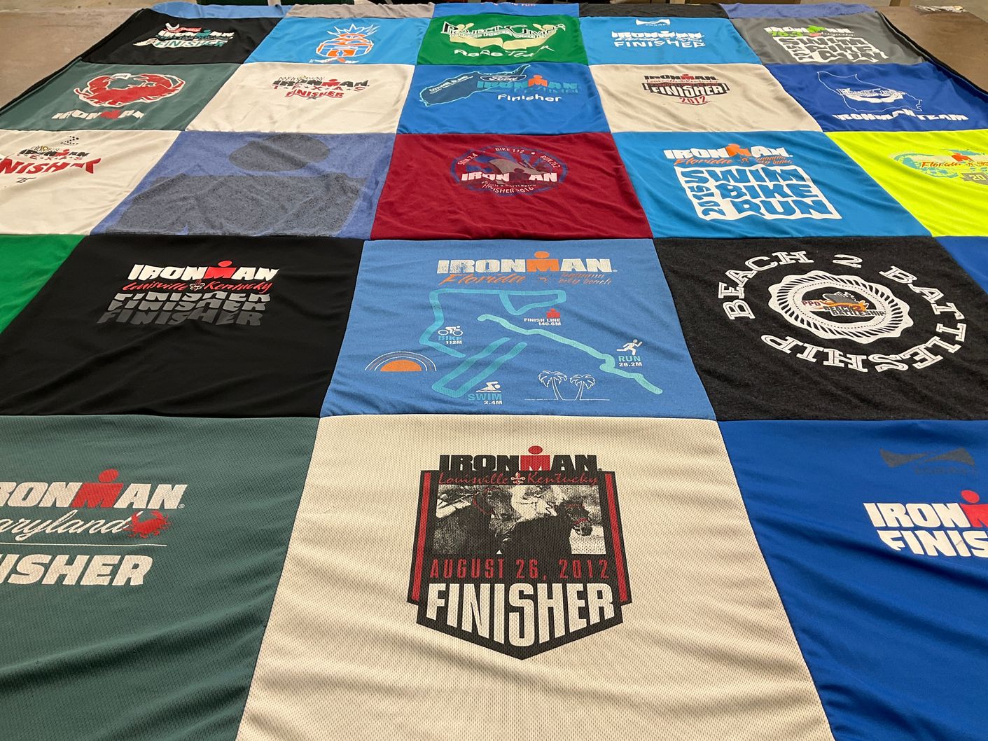 T-shirt quilt with triathlon, endurance events themes by Toni from GA
