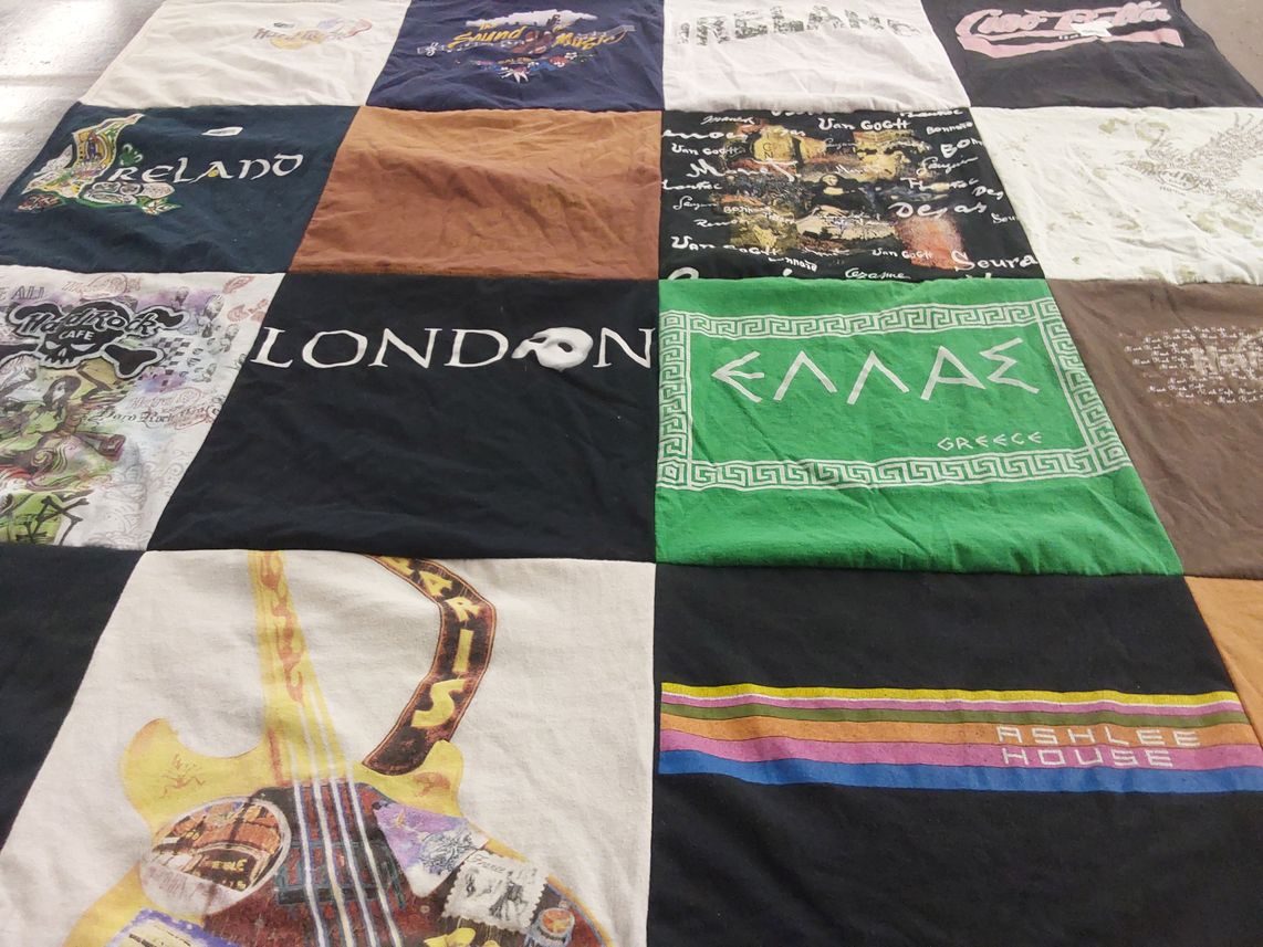 T-shirt quilt with travel, music themes by Bliss from AR