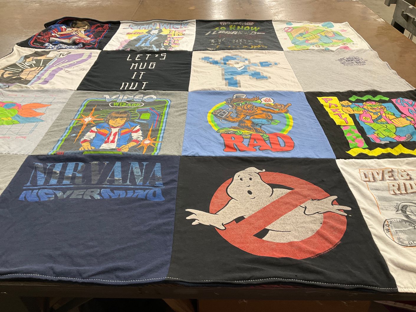 T-shirt quilt with music, video games themes by Albert from WI
