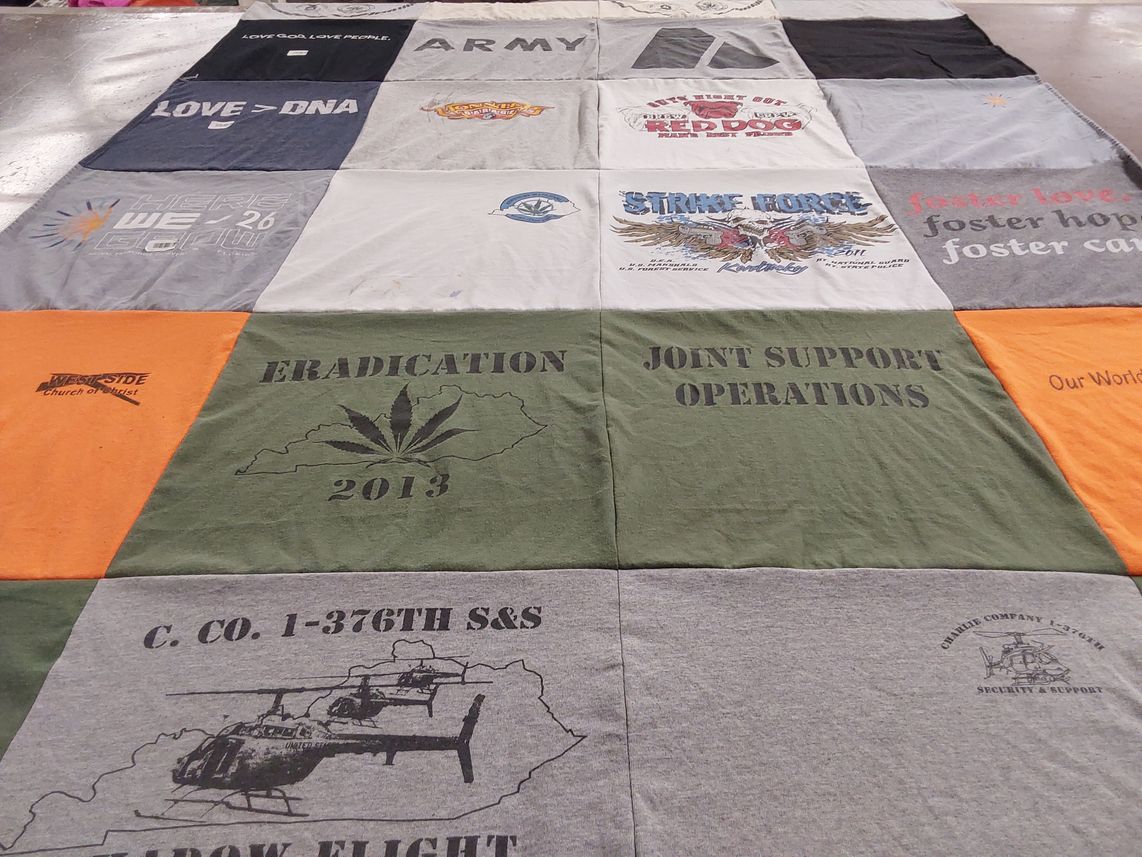 T-shirt quilt with community, support themes by Tim from KY