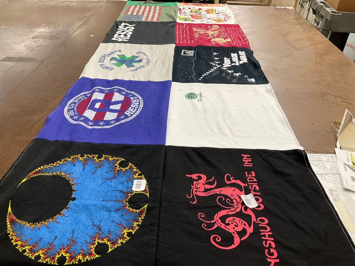 T-shirt quilt with activism, environmentalism themes by Carla from IL