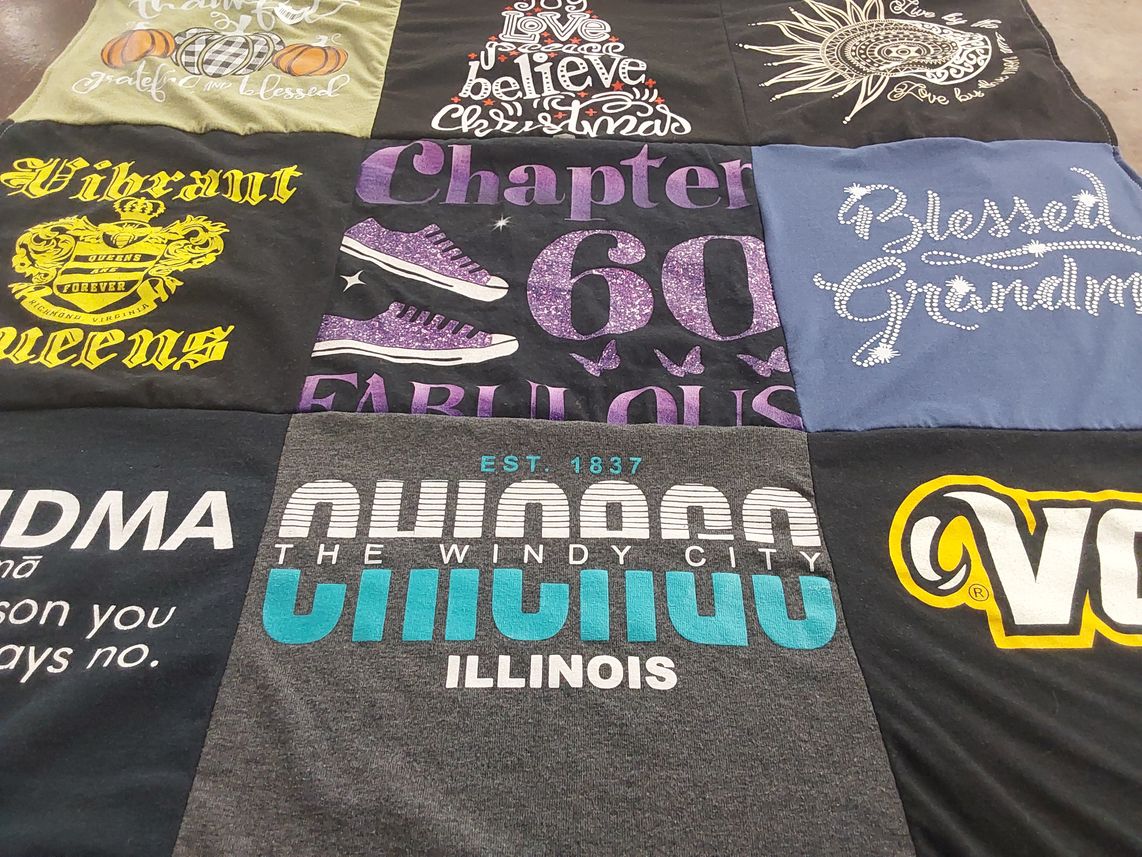 T-shirt quilt with family, community themes by Dana  from VA