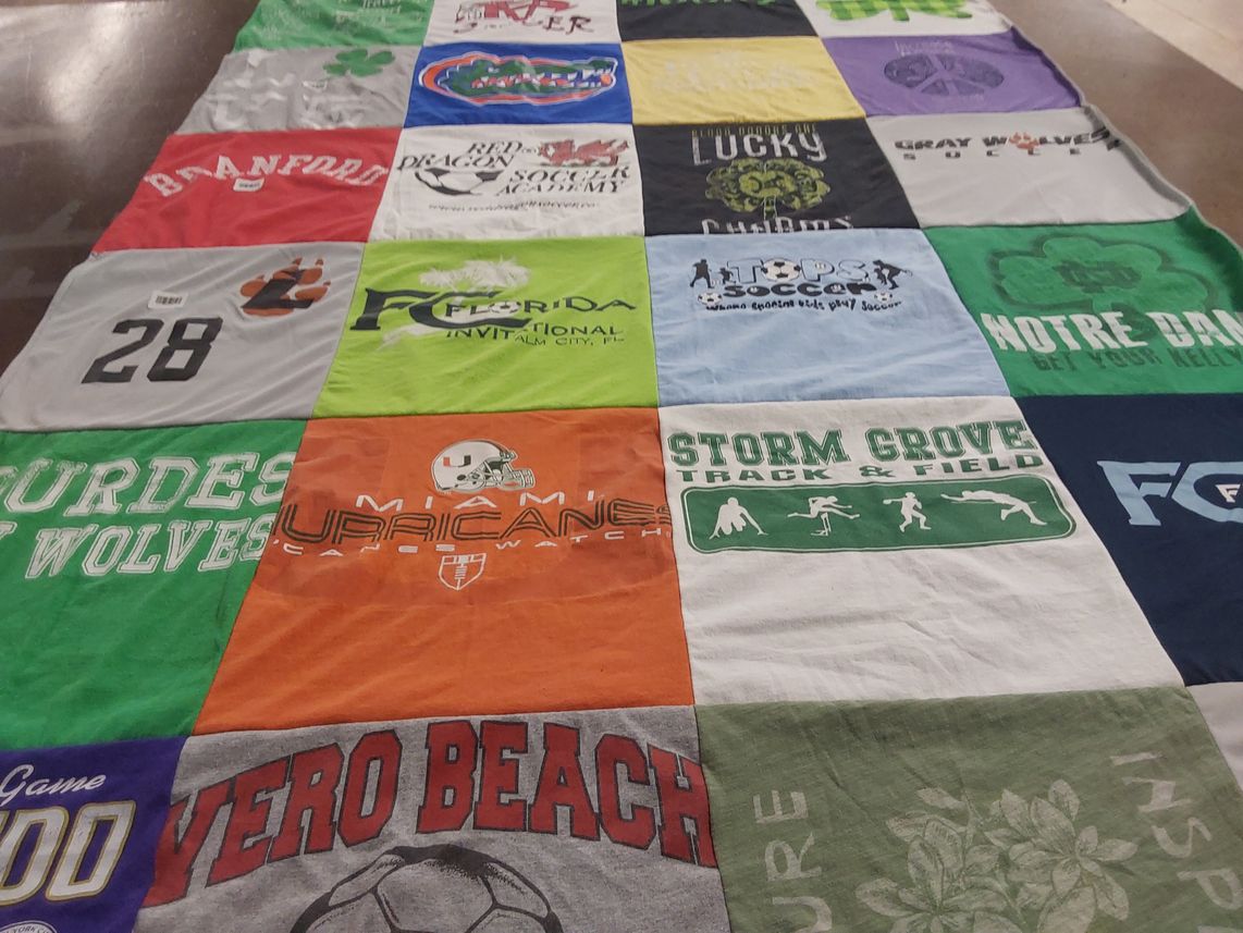 T-shirt quilt featuring burdes high school wolves, storm grove track and field by Kelly from FL