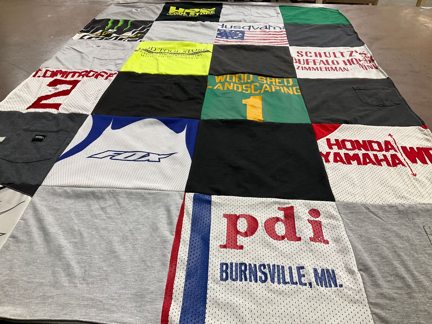 T-shirt quilt with landscaping, motorsports themes by Susan from MO