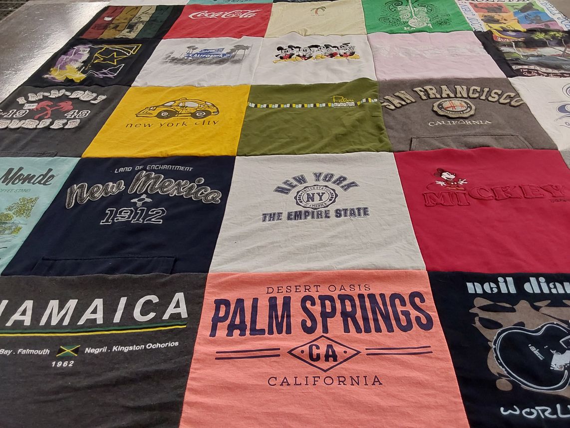 T-shirt quilt with travel, vacation themes by Emily from OR