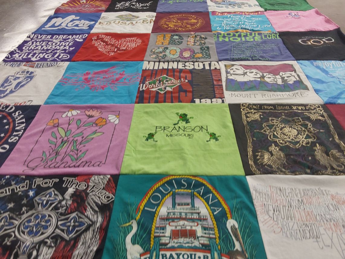 T-shirt quilt with travel, family themes by Debbie from MN