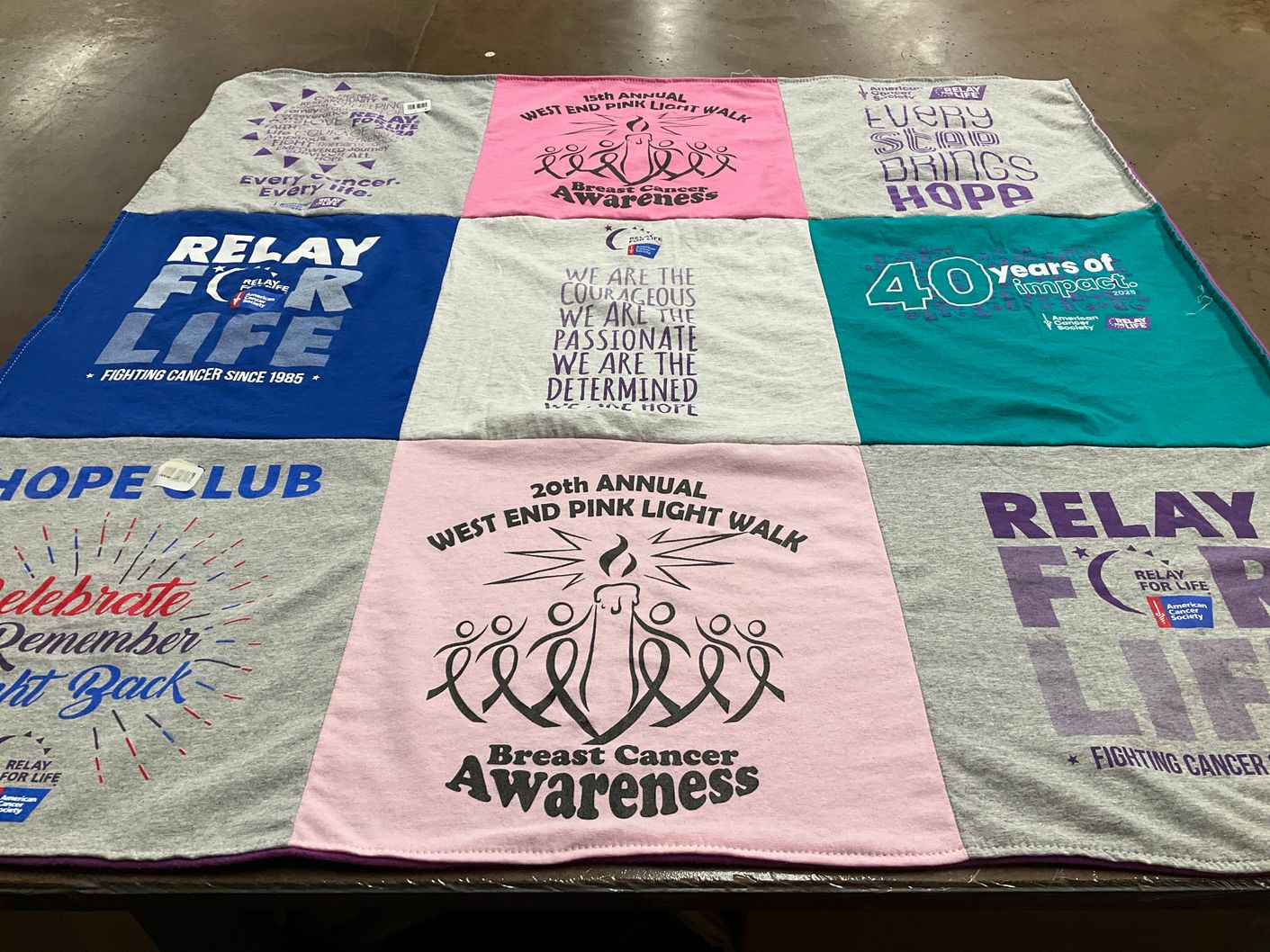T-shirt quilt with cancer awareness, community events themes by Susan from PA