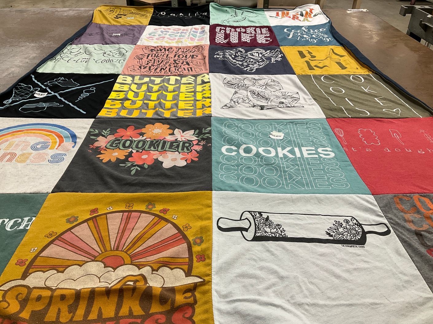 T-shirt quilt with baking, cooking themes by Michelle from IA