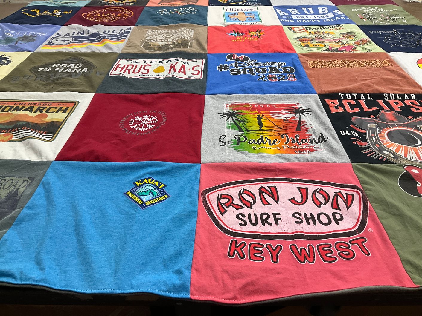 T-shirt quilt with travel, surfing themes by Jessie from TX